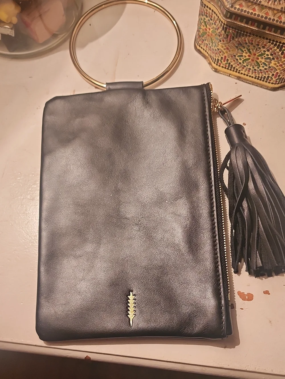 Thacker Black Leather Wristlet Clutch with Gold Ring Handle